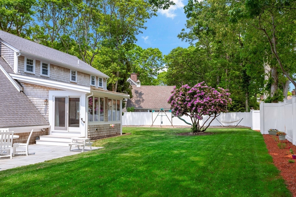 Spacious backyard with sunroom view