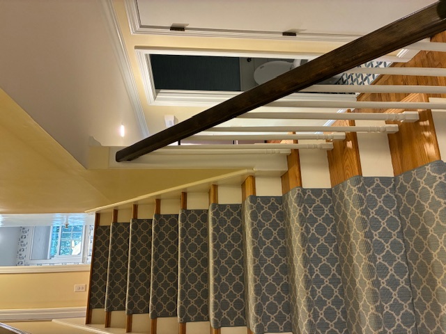 Staircase with patterned carpet runner