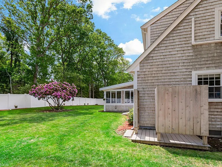 Side of house with outdoor shower