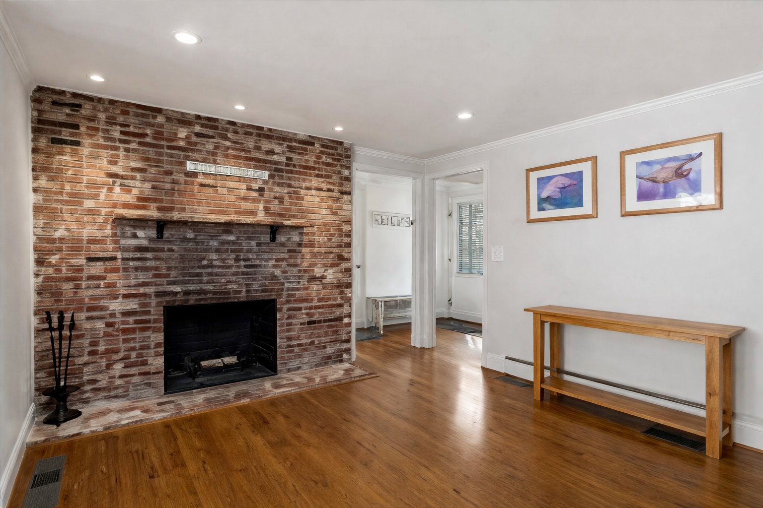 Brick fireplace and hardwood floors